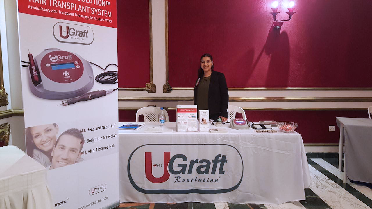 The Dr.UGraft exhibitor booth at the 2018 Live Surgery Workshop in Dubai. Taken moments before the influx of doctors arrived and cleared the available selection of punches, sharpening stones, and complimentary candy. 